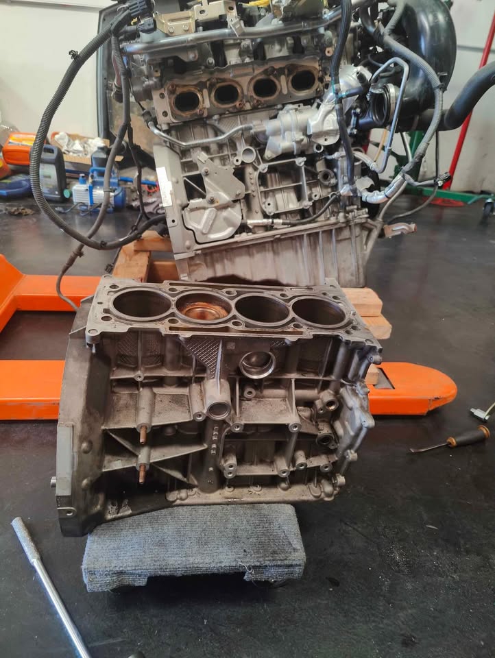 blown engine and used good engine of a 2015 Mercedes C300 at club spec garage